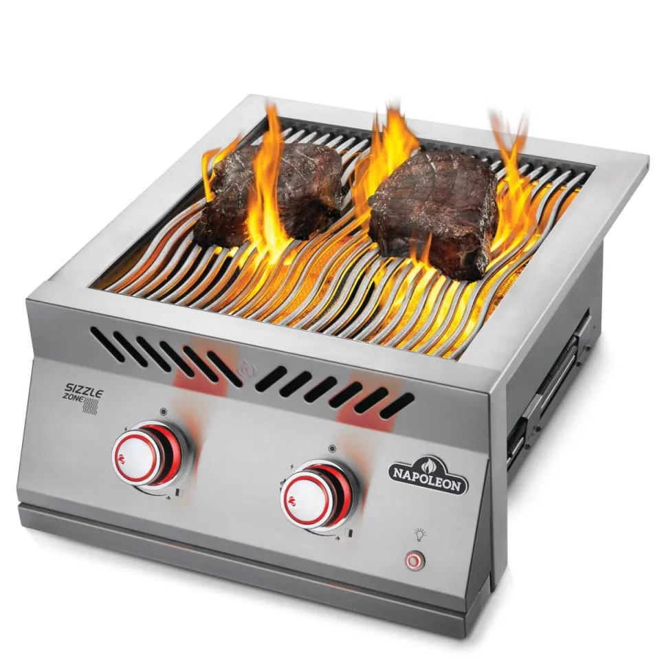 Napoleon SIZZLE ZONE™ side burner with steaks and visible flame for intense searing
