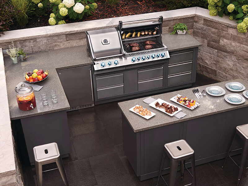 Best built in grills 2025 – Napoleon outdoor kitchen with stainless steel grill, searing meats, and luxury island setup