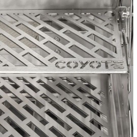 Close-up of Coyote Outdoor Living grill with laser-cut stainless steel cooking grates and precision-engineered design.