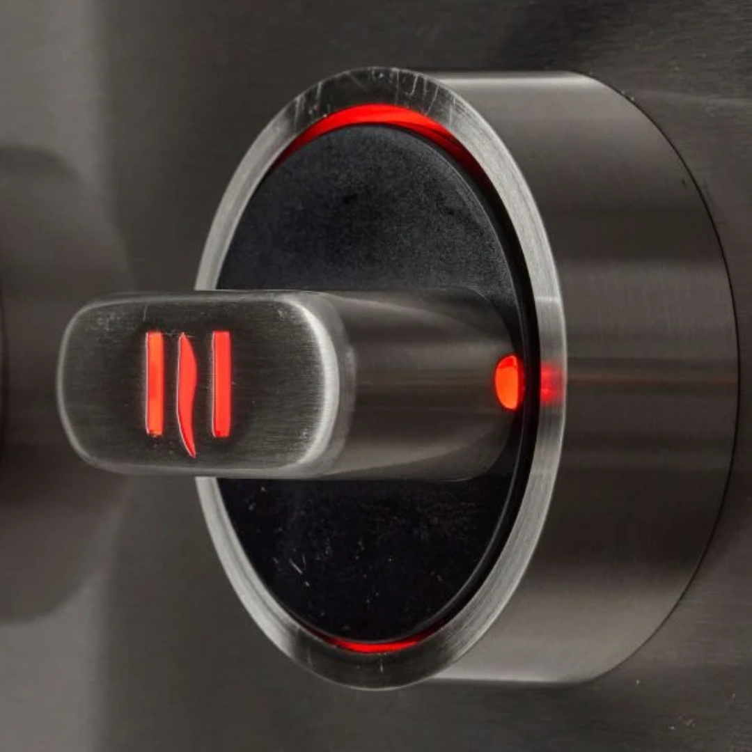 Coyote SL-Series grill knob with glowing red multi-color LED backlighting for premium nighttime cooking control.