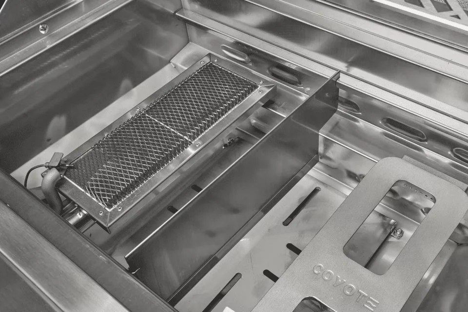 Coyote interchangeable sear burner for intense, high-temperature grilling.