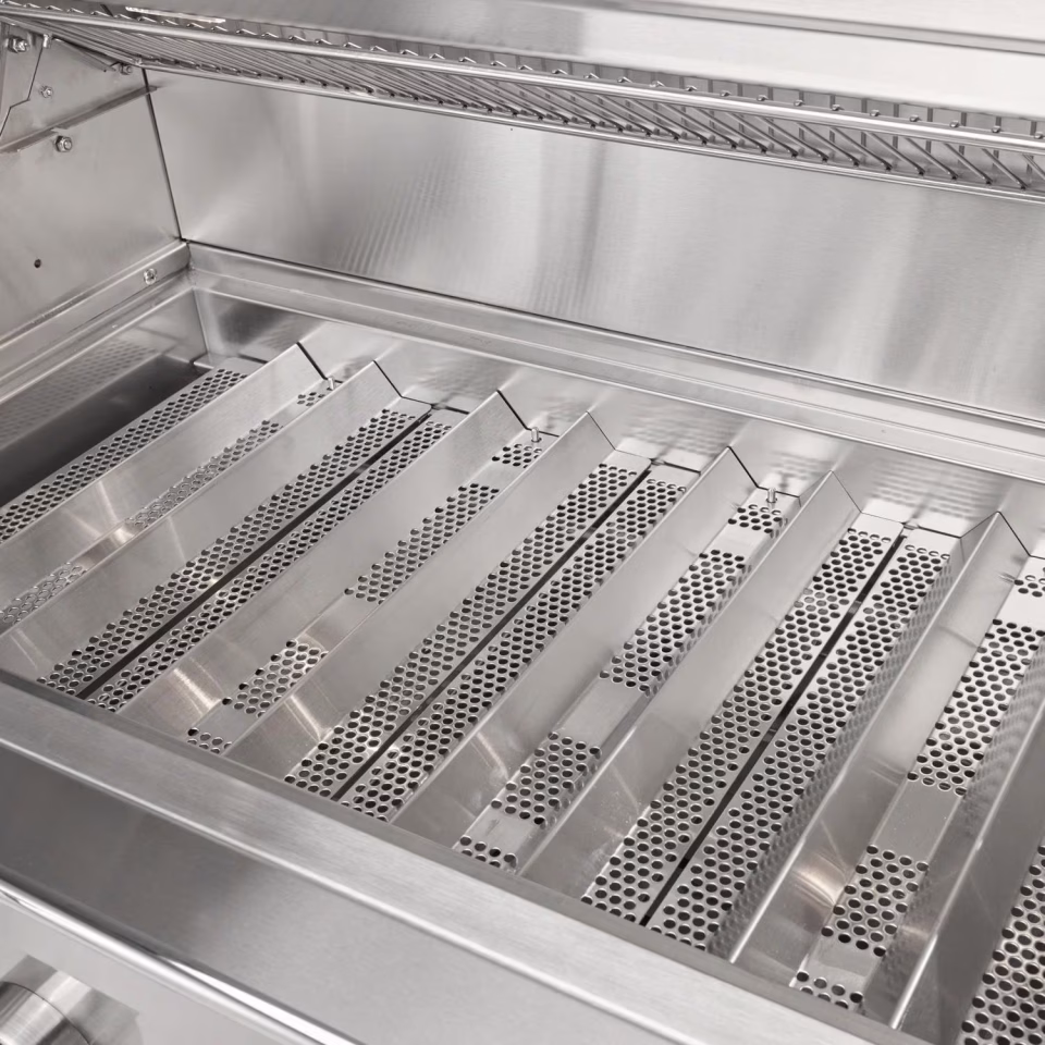 Close-up of stainless steel heating grid used in Coyote Outdoor Living grills for consistent flame control.