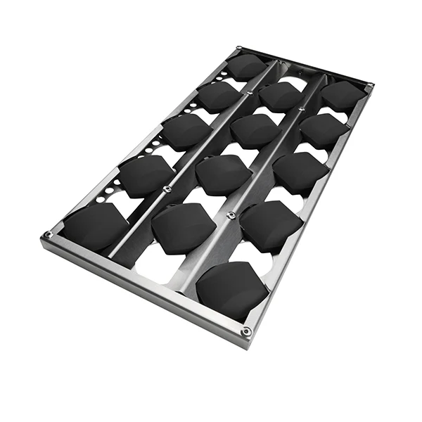 Durable ceramic volcanic briquettes in a stainless steel tray, designed to retain heat and reduce flare-ups in Coyote grills.