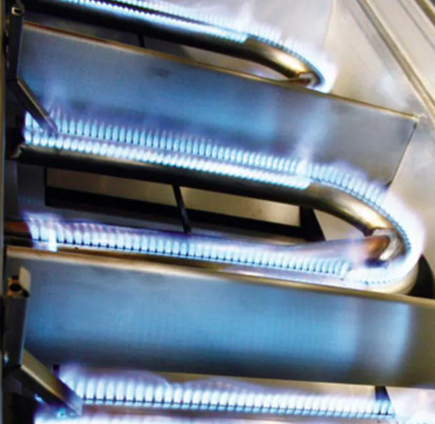 Twin Eagles stainless steel gas burners ignited, highlighting direct heat output and precision grilling technology.