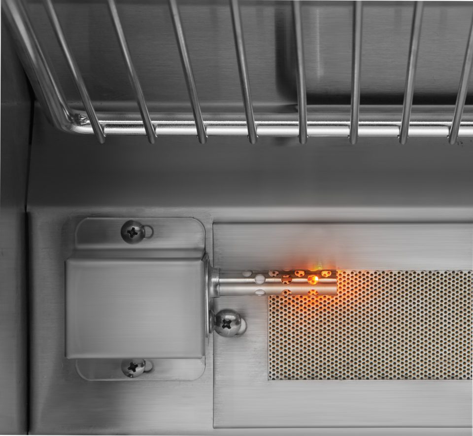 Close-up of Twin Eagles ignition system with stainless steel burner and glowing flame for fast and safe startup