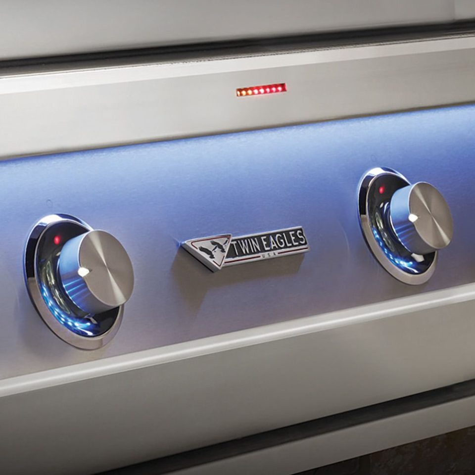 Twin Eagles Eagle One built in grill with TempTrack™ LED lights and precision control knobs glowing blue and red
