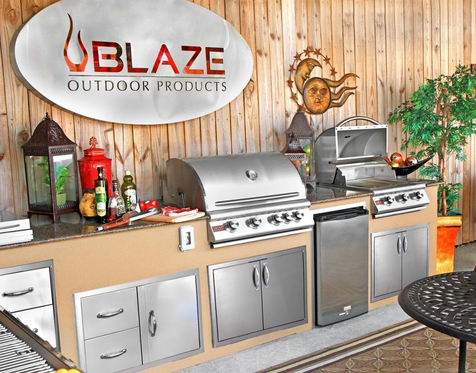 Blaze grill models displayed in a luxury outdoor kitchen featuring stainless steel BBQ options