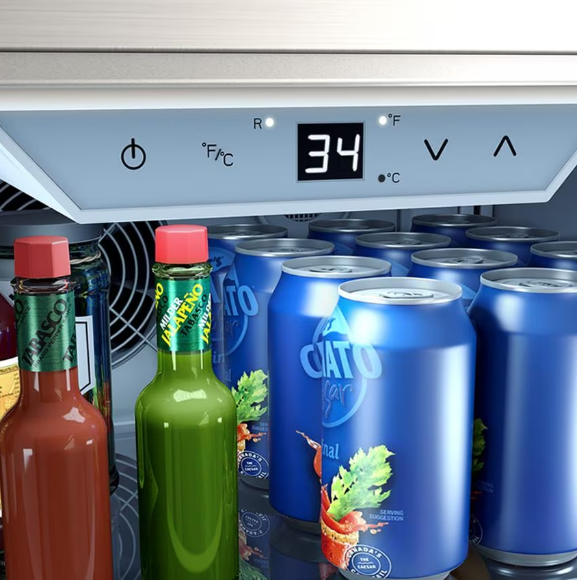 Interior of a Zephyr outdoor refrigerator showing digital temperature control and neatly arranged beverage cans and sauces at 34°F.