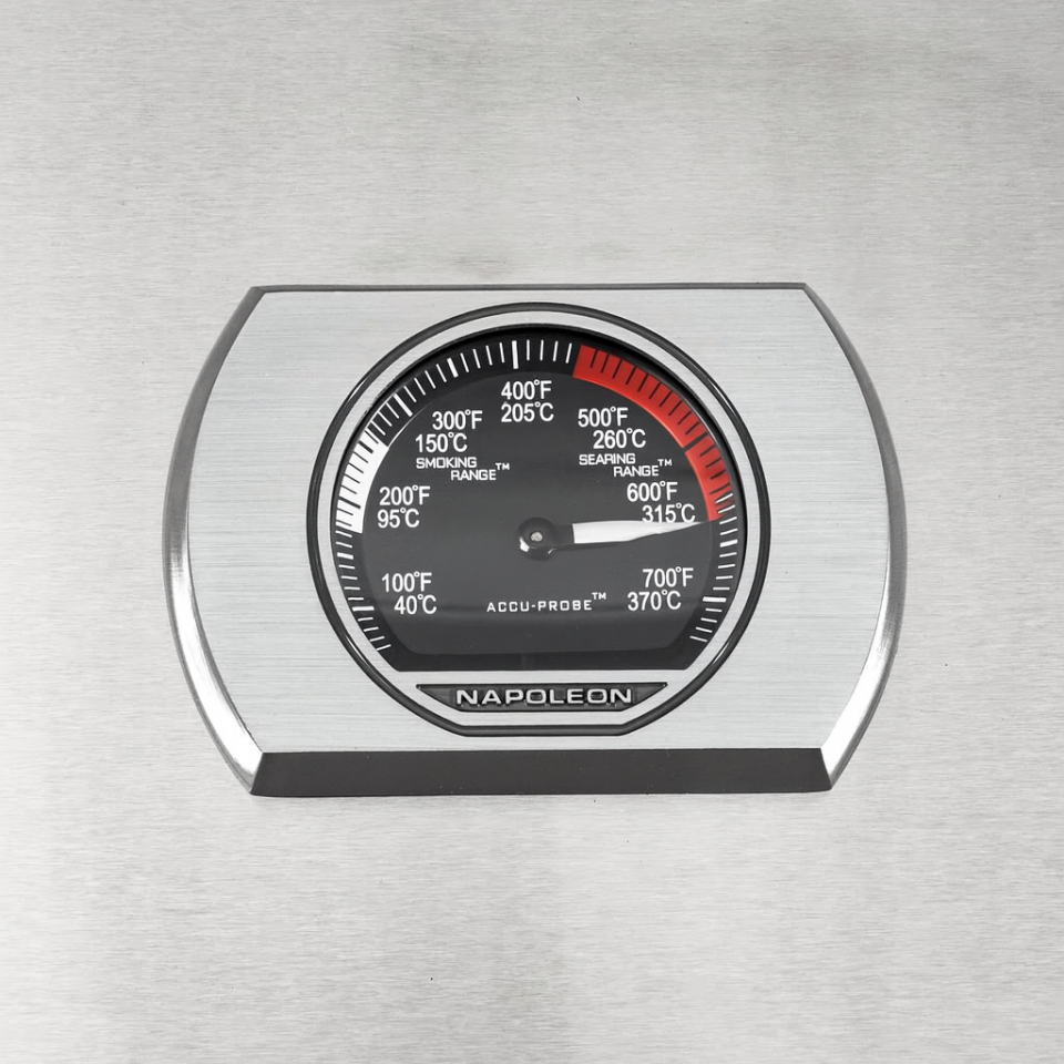 Napoleon grill thermometer showing around 700°F for high-heat searing performance