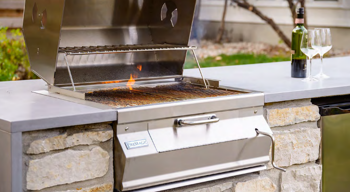Fire Magic built-in charcoal grill installed in a luxury outdoor kitchen—highlighting premium design and versatile cooking options