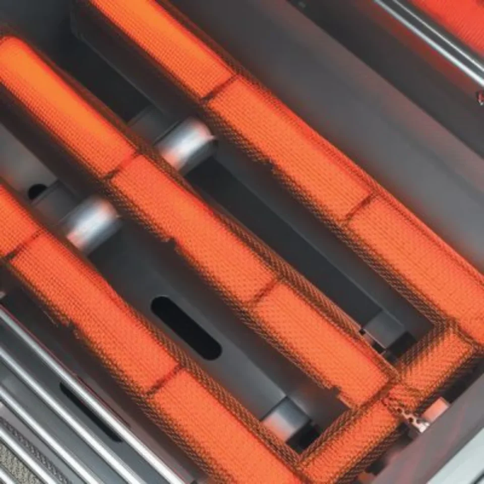 Close-up of the Lynx Trident infrared burner glowing red-hot, showcasing powerful heat output and precision gas burner technology.