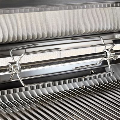 Lynx rotisserie burner with chicken roasting on spit inside grill