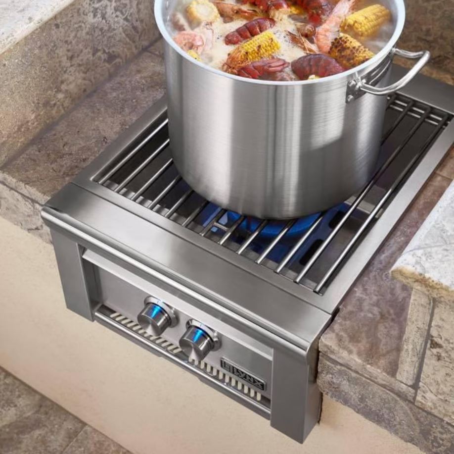 Lynx Professional power burner with glowing red-brass rings under wok