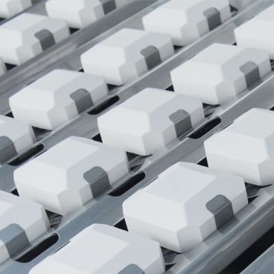 Lynx ceramic radiant briquettes glowing with flame underneath grill grates