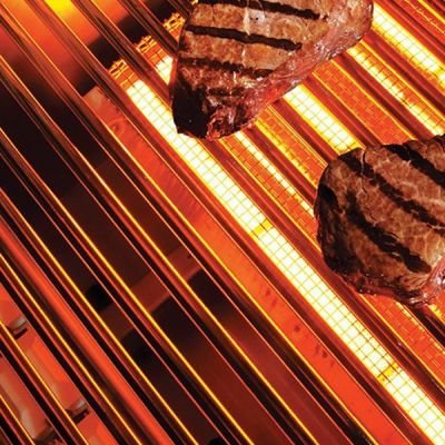 Lynx ProSear infrared burner glowing red under stainless steel grate