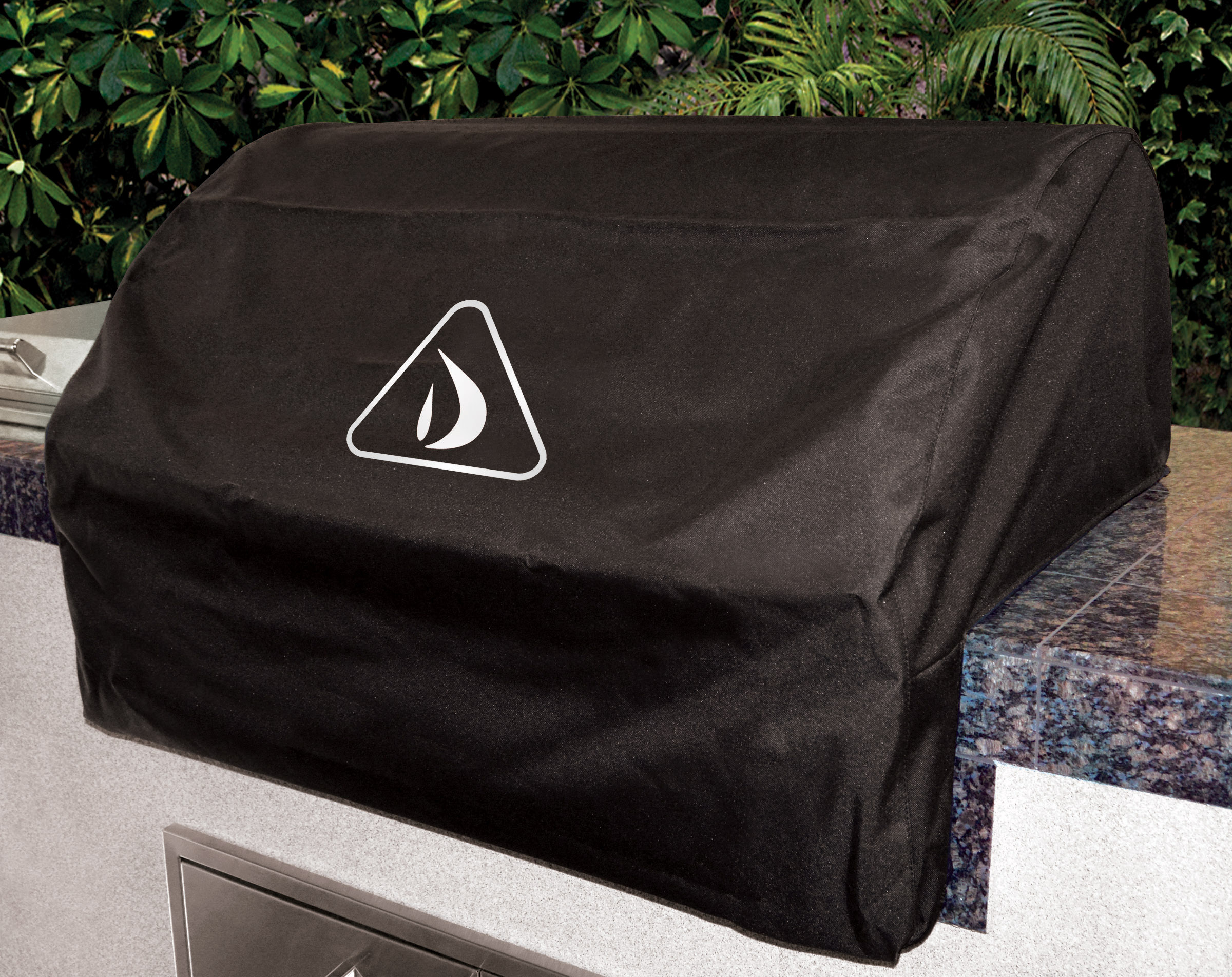 Delta Heat Heavy-Duty Vinyl Cover for Built-In Grills, shown on outdoor kitchen island