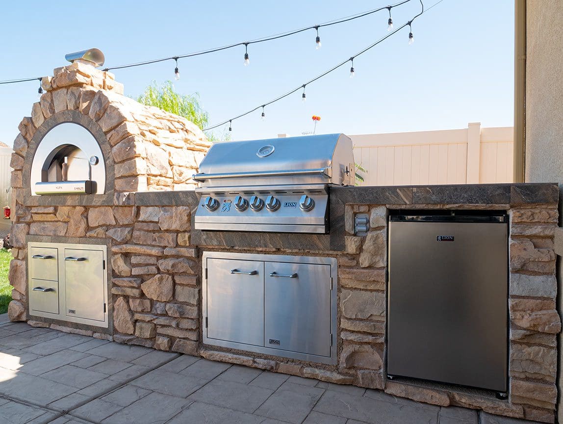 Lion L75000 grill built into a custom stone BBQ island