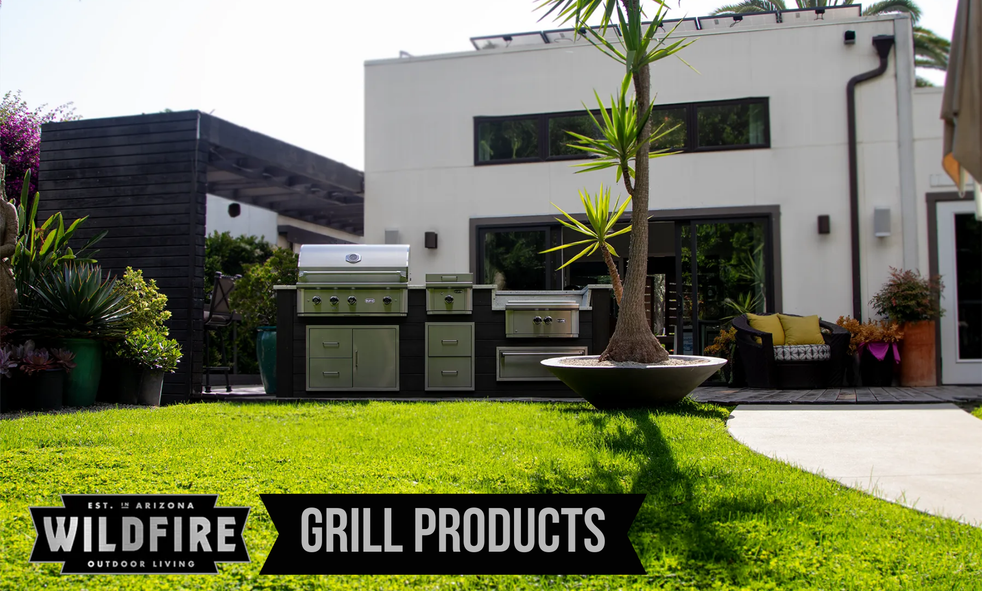 Wildfire Grill Products outdoor kitchen setup with built-in grill, side burner, and storage in a modern backyard