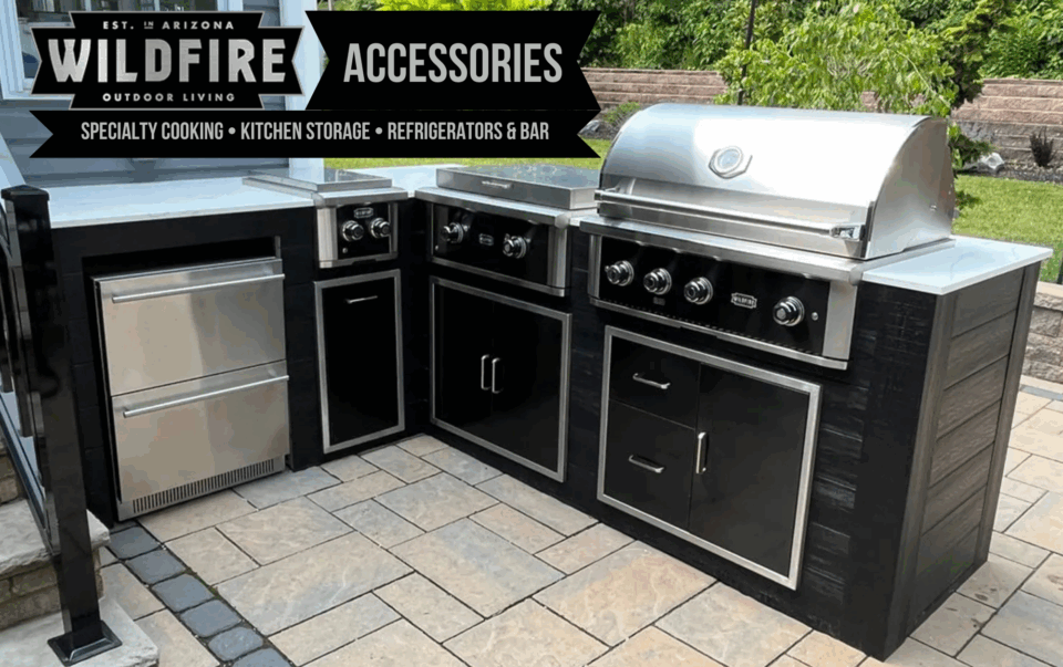 Wildfire Grill Accessories outdoor kitchen setup with black stainless steel grill, side burner, double refrigerator drawers, and storage doors & drawers