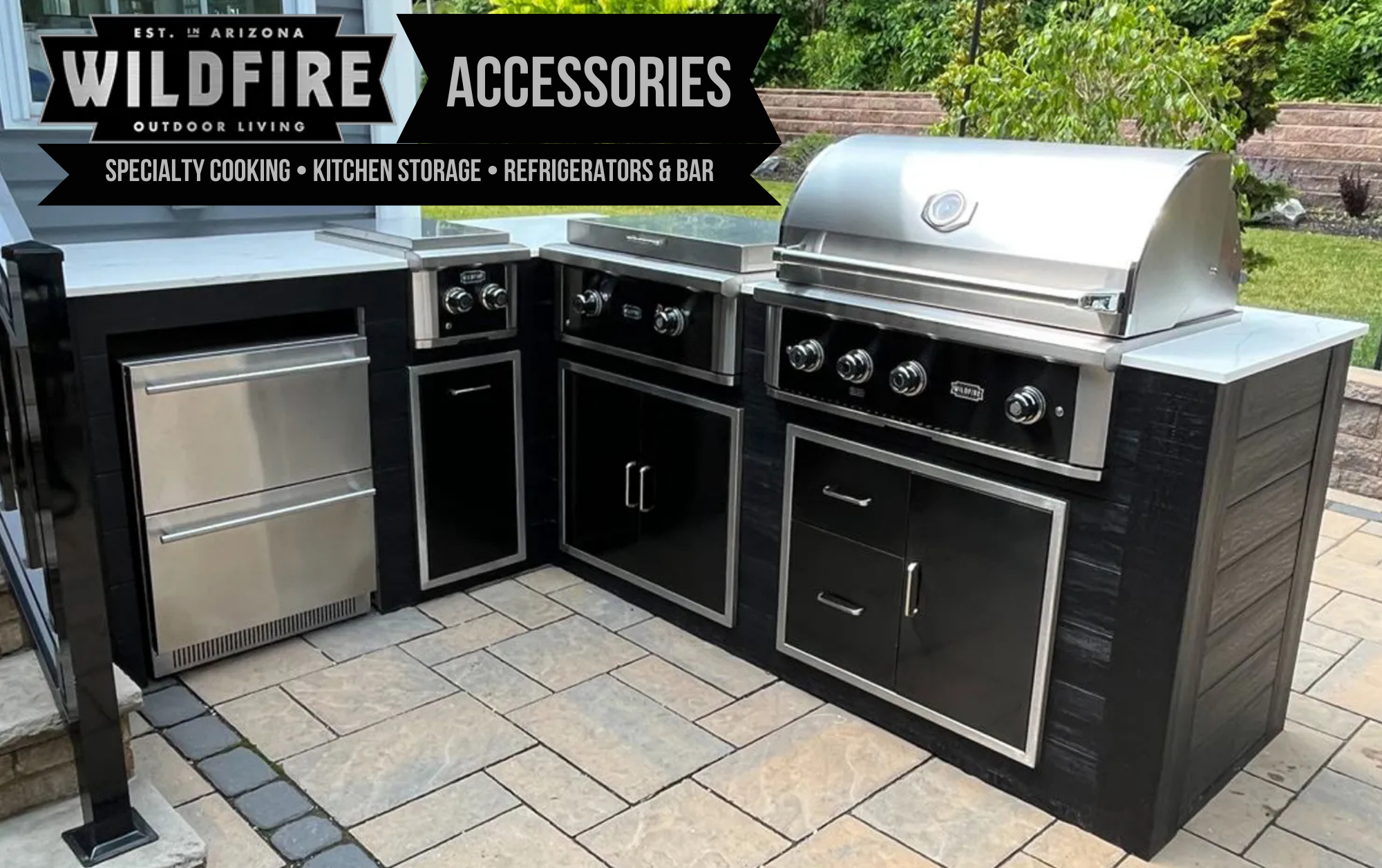 Wildfire Grill Accessories outdoor kitchen setup with black stainless steel grill, side burner, double refrigerator drawers, and storage doors & drawers