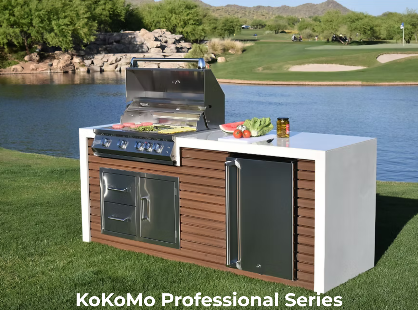 Professional KoKoMo built-in grill setup with evening lighting and modern island
