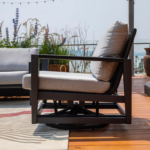 Elementi OS-2506W Laguna Outdoor Aluminum Swivel Club Chair w Sunbrella Cushions - Side View - Lifestyle