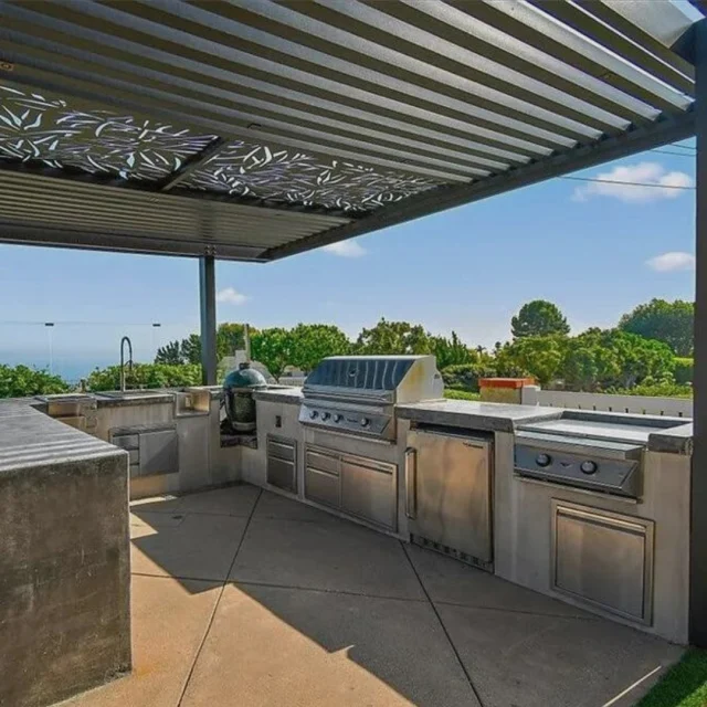 Concrete lines, stainless‑steel shine, ocean on the horizon—just another day in a Best of Backyard paradise. 🔥🌊⁠
⁠
• Twin Eagles centerpiece grill⁠
• Big Green Egg for low‑and‑slow perfection⁠
• Dual side burner + drop‑in sink⁠
• Built‑in fridge to keep the drinks icy⁠
• Shadow‑casting laser‑cut pergola overhead⁠
⁠
We design, build, and install setups like this from concept to first sizzle—so you can simply step outside and cook like a pro. What would you christen this island with first? 👇⁠
⁠
#BestOfBackyard #CreateYourPerfectSpace #TwinEagles #OutdoorKitchenGoals #CaliforniaBackyard